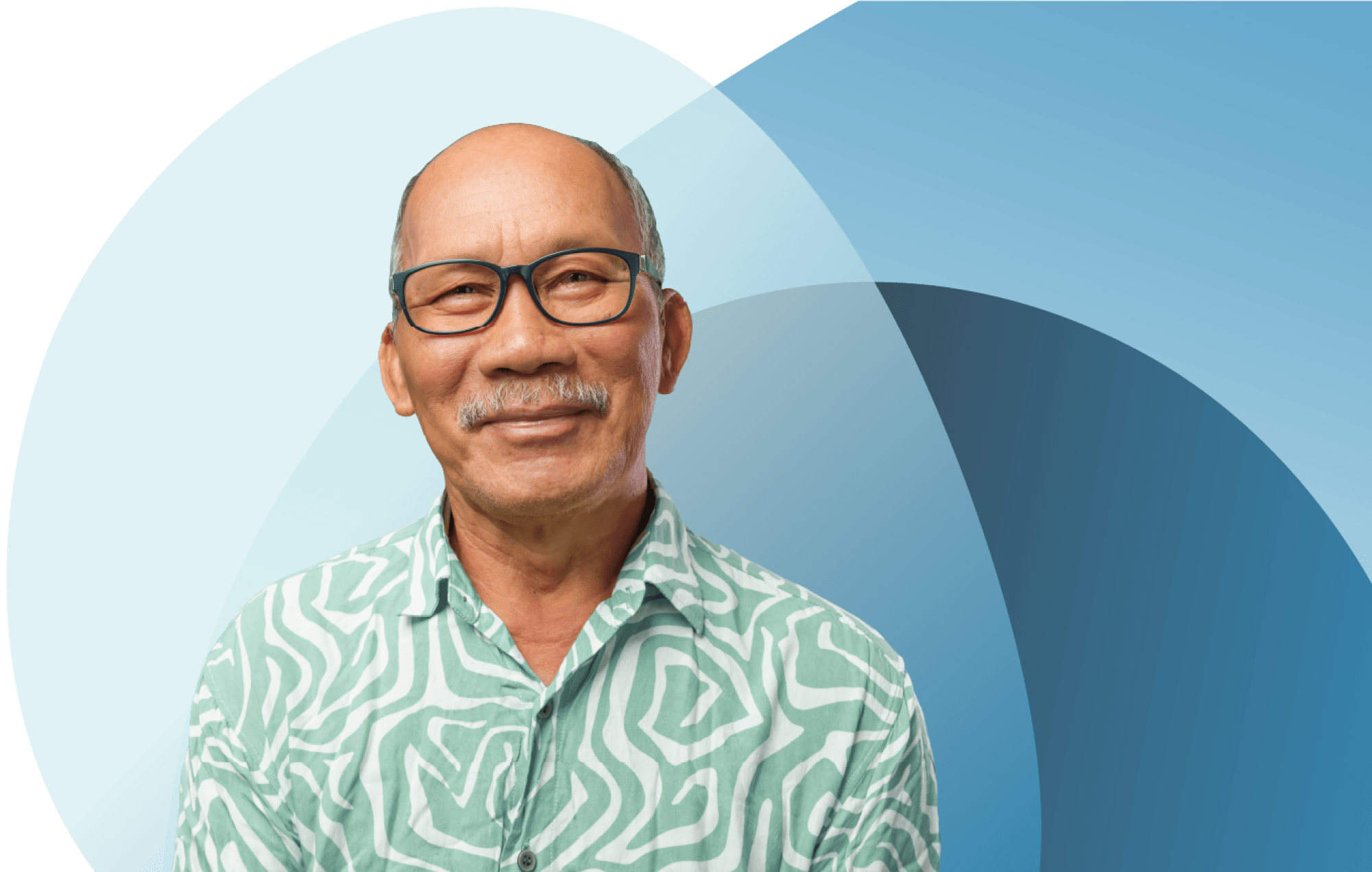 Smiling man in patterned shirt